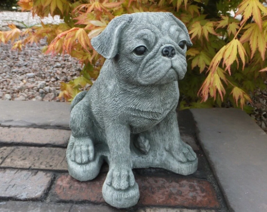 Pug dog sitting statue