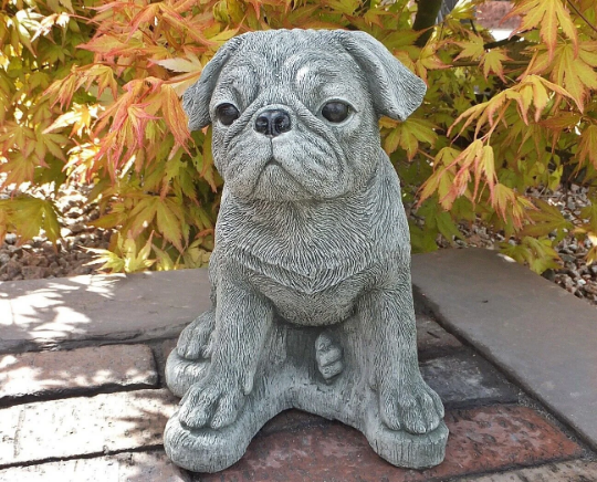 Pug dog sitting statue