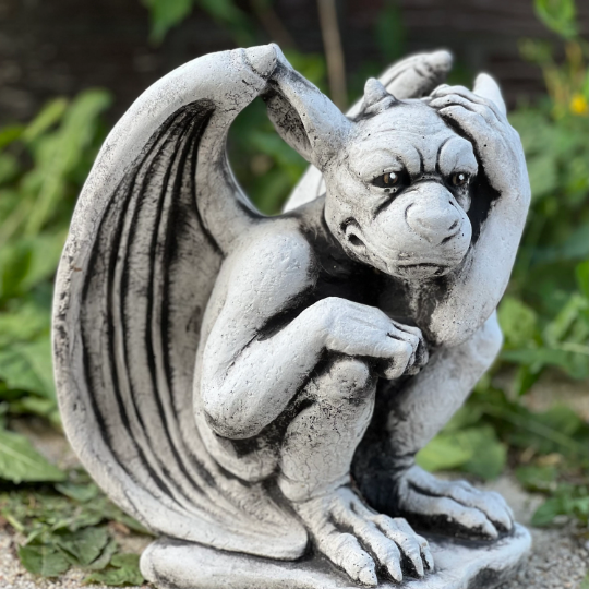 Sitting gargoyle statue