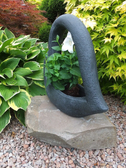 Black heart pot statue