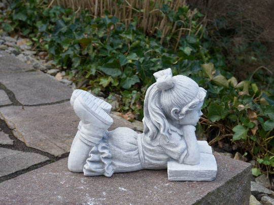 Large reading girl statue