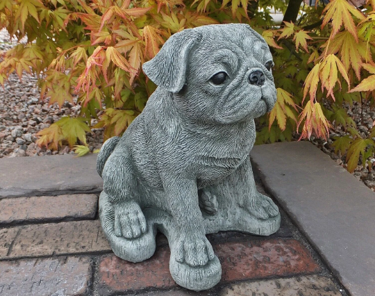 Pug dog sitting statue