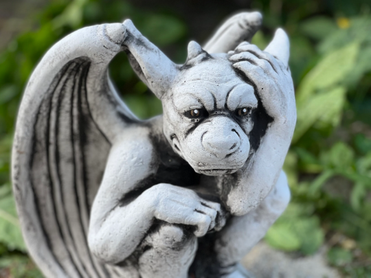 Sitting gargoyle statue