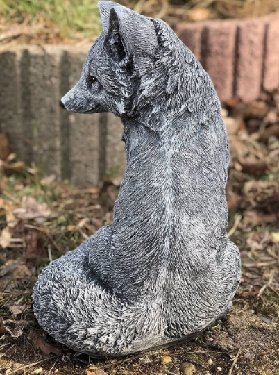 Concrete sitting fox figurine