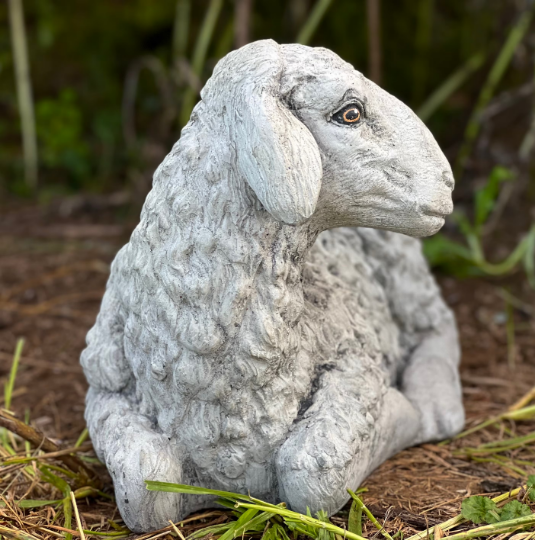 Lying lamb with ears down statue