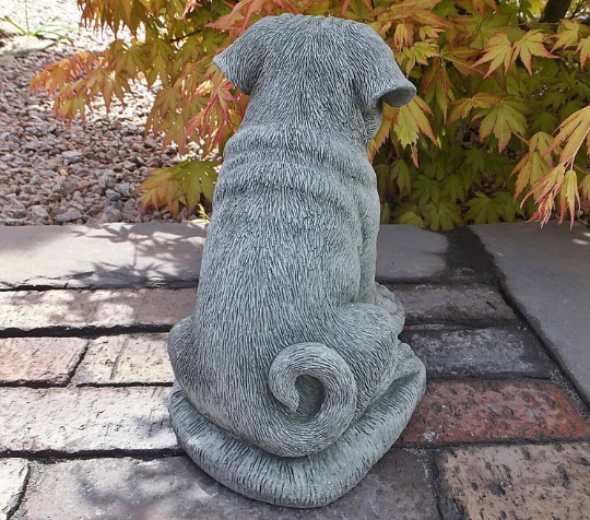 Pug dog sitting statue