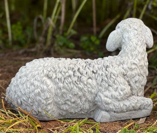 Lying lamb with ears down statue