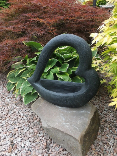 Black heart pot statue