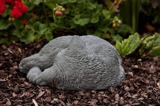 Curled up sleeping cat figurine