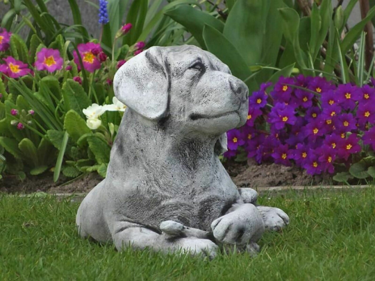 Labrador dog laying statue