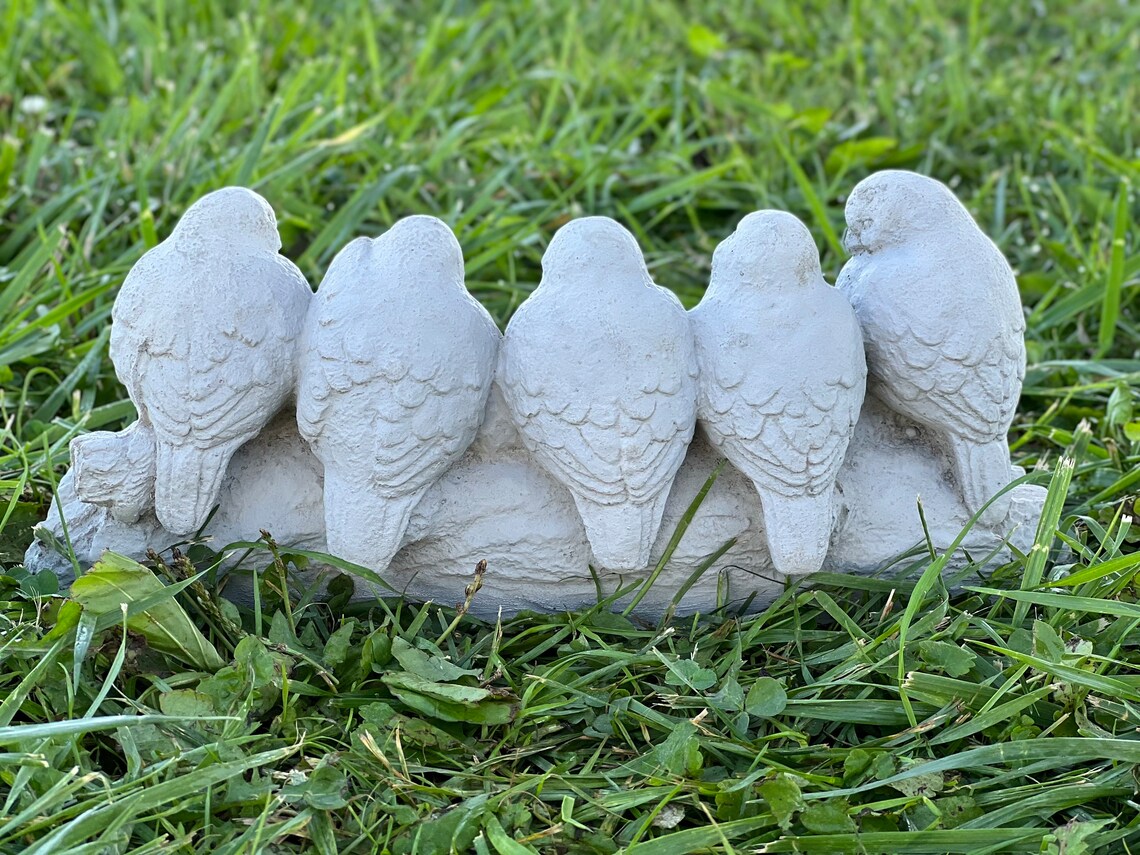 Five birds sitting on stump figurine