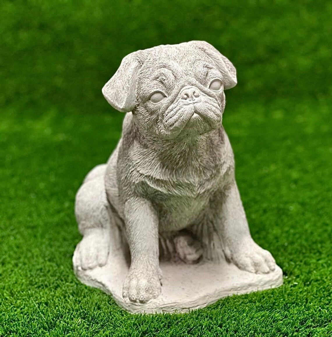 Sitting puppy pug concrete memorial