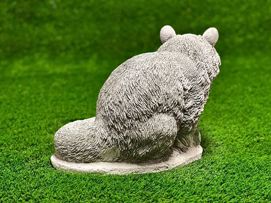 Sitting raccoon figure