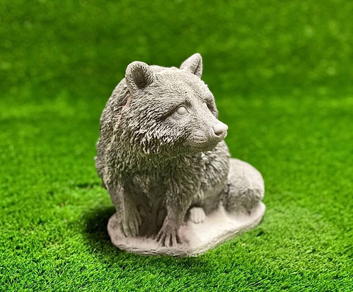 Sitting raccoon figure