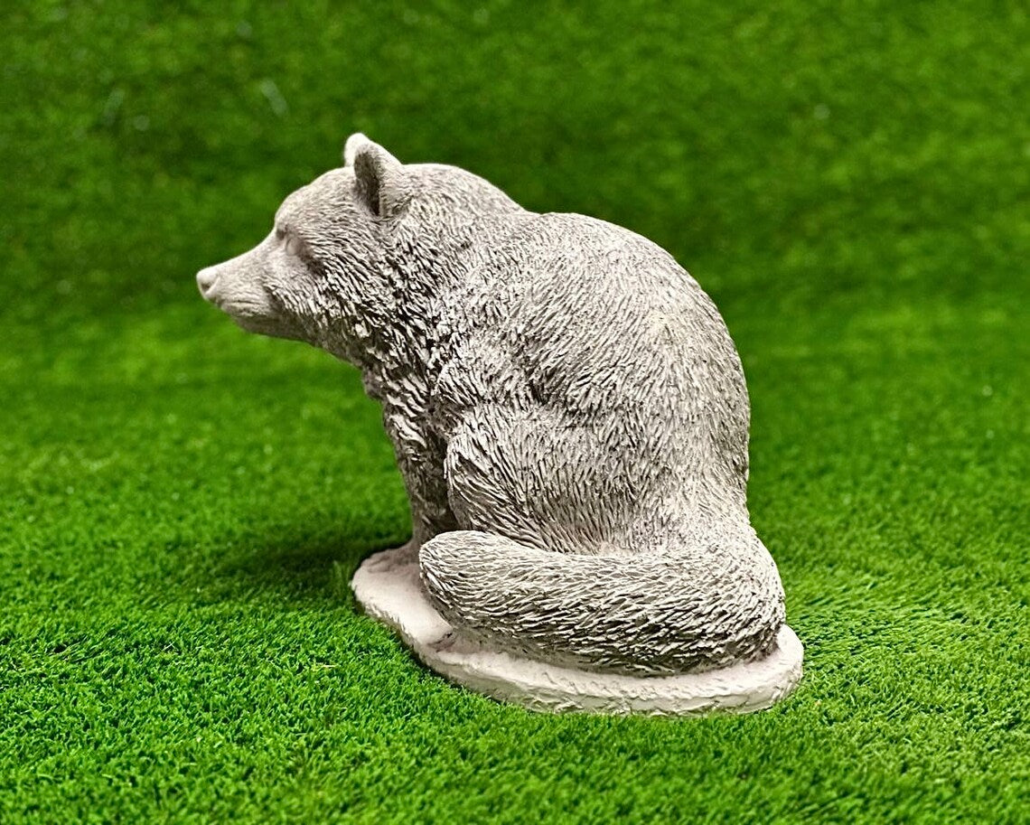 Sitting raccoon figure