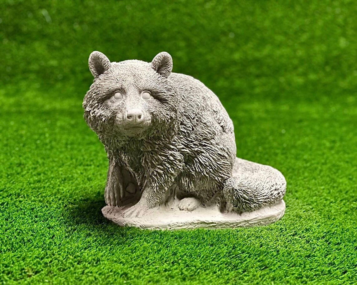 Sitting raccoon figure