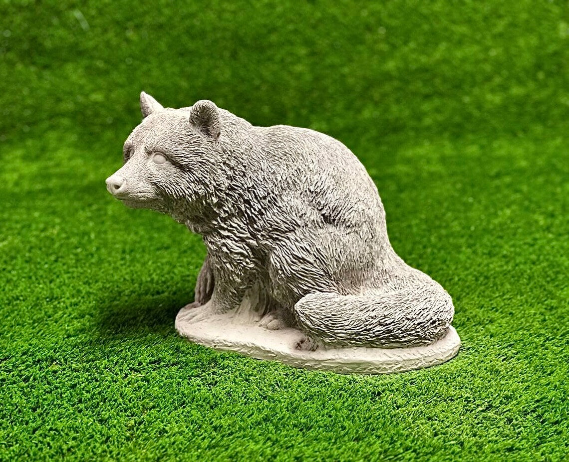 Sitting raccoon figure