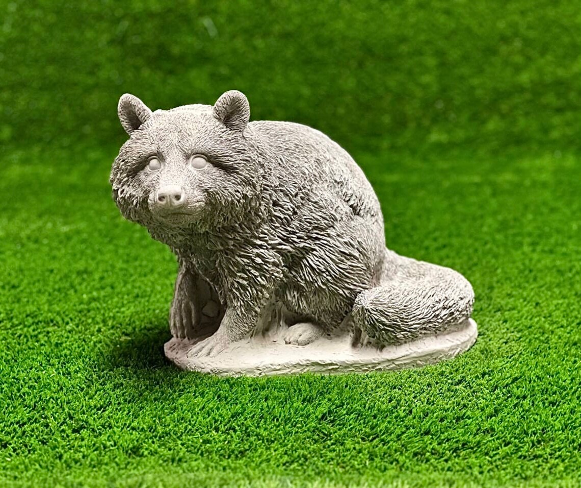 Sitting raccoon figure