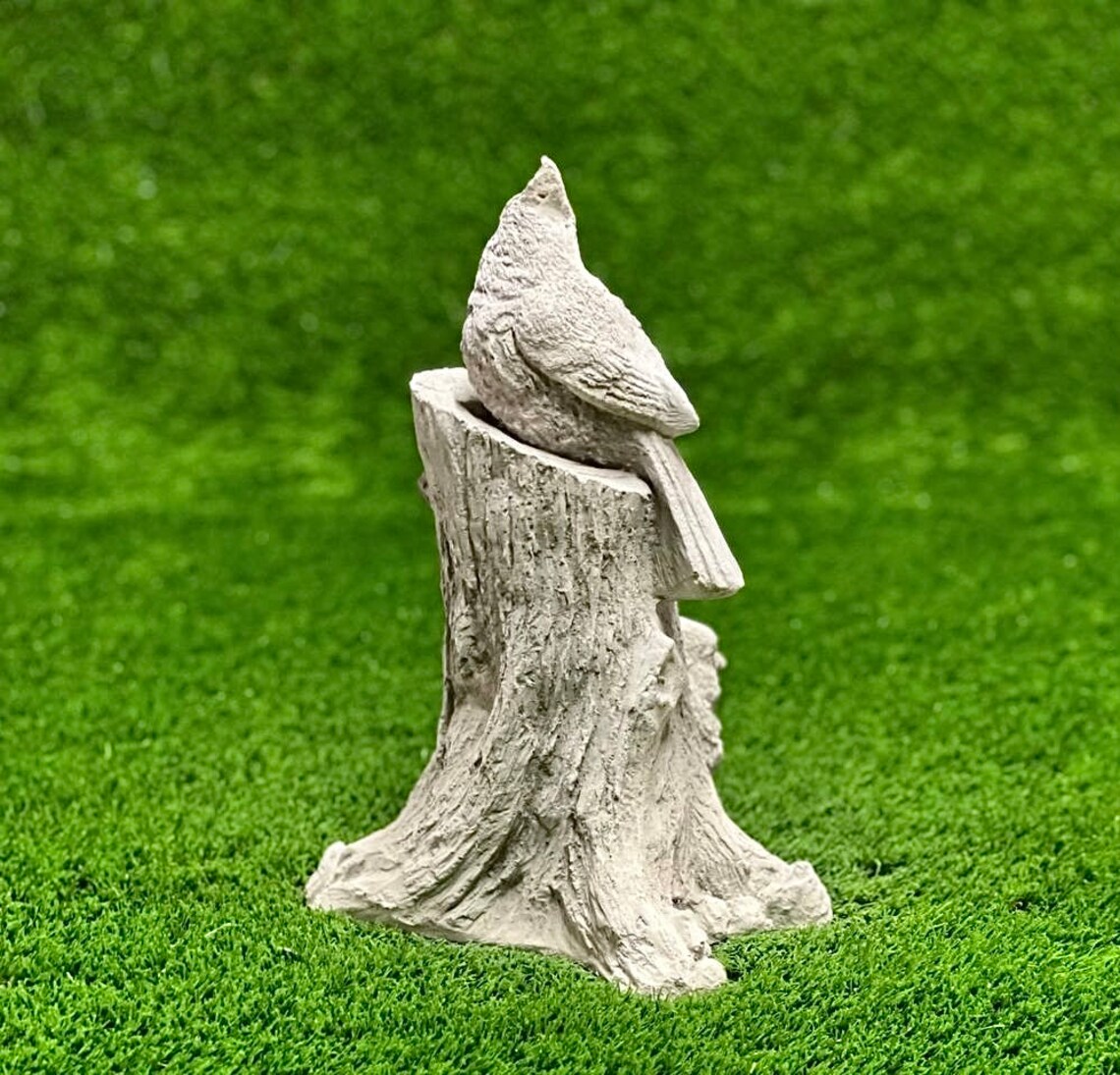 Cardinals on stump statue