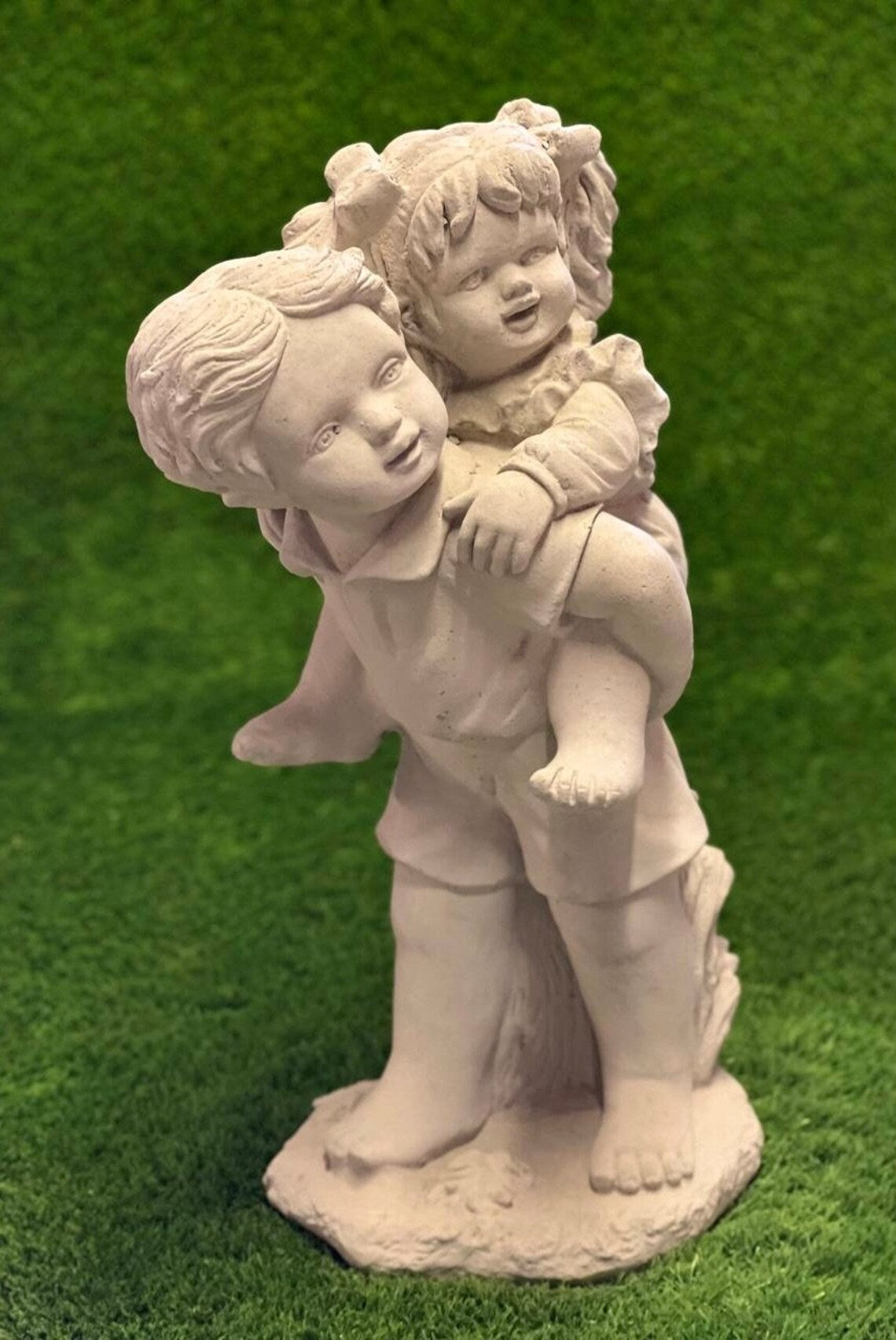Kids piggy back statue