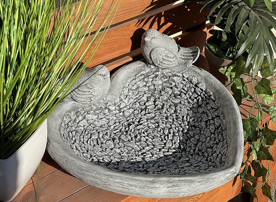 Water drinker with birds sculpture