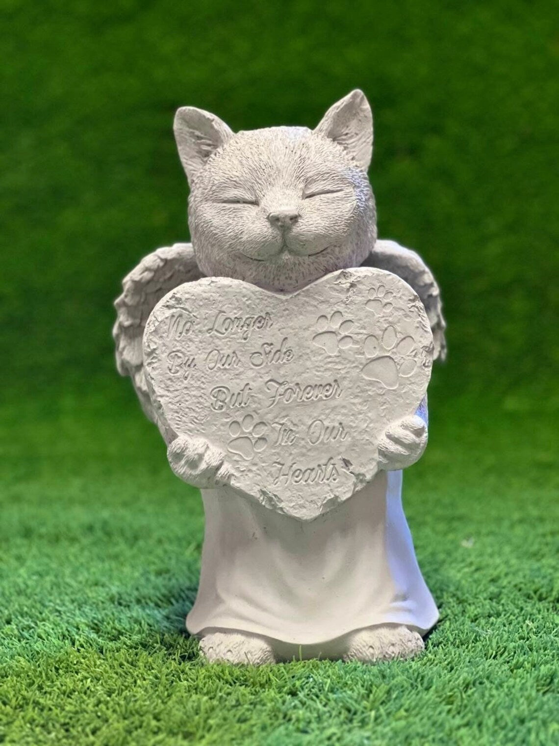 Concrete praying cat with wings