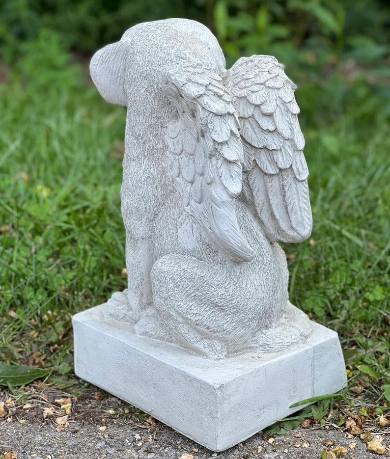 Sitting dog memorial with wings