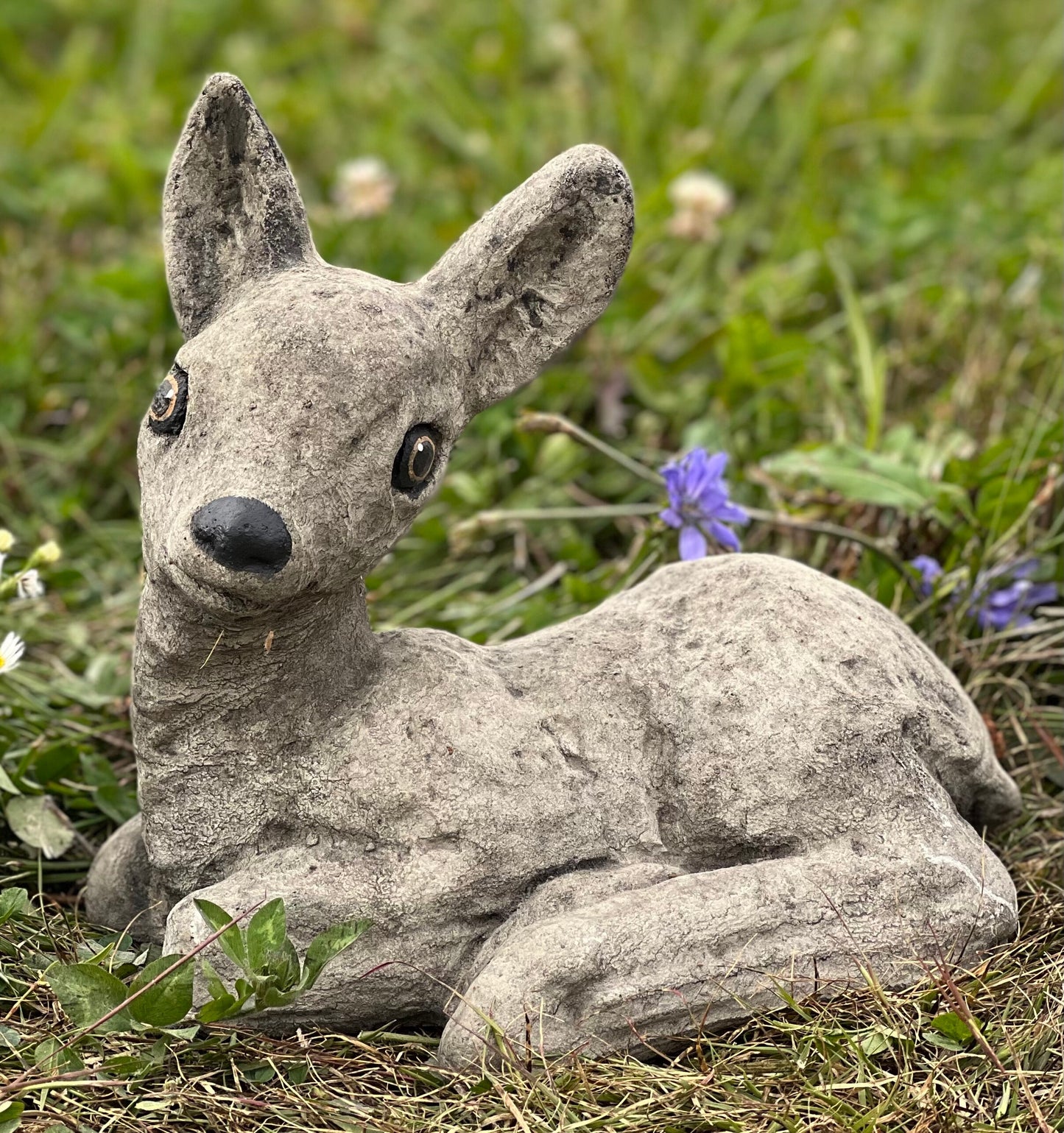 Deer laying statue