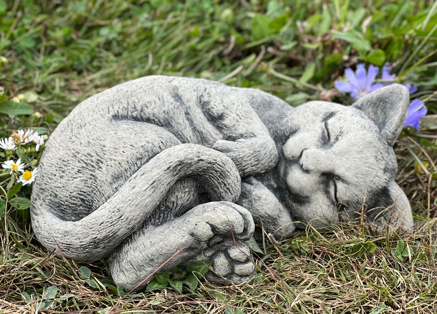Laying cat statue