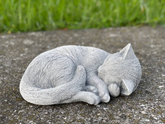 Concrete laying cat figurine