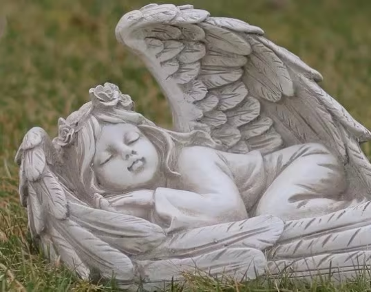 Sleeping angel figurine