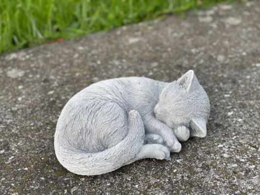 Concrete laying cat figurine