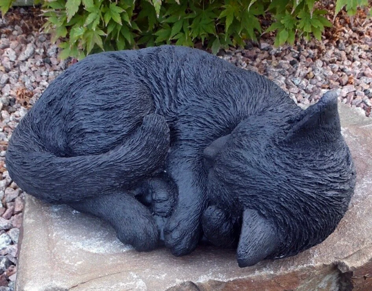 Laying black cat figure