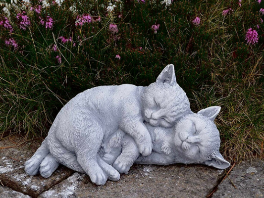 Two sleeping cats statue