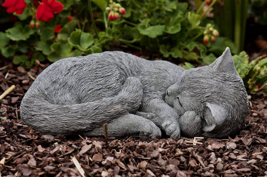 Curled up sleeping cat figurine