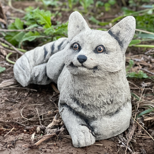 Lying concrete cat figurine