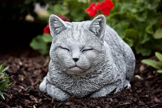 Cat sleeping concrete statue