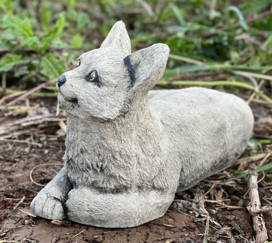 Lying concrete cat figurine