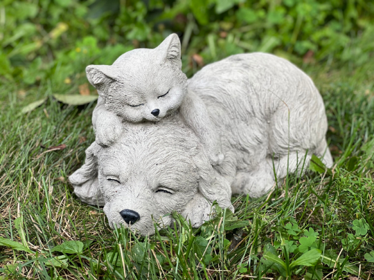 Sleeping cat and dog statue