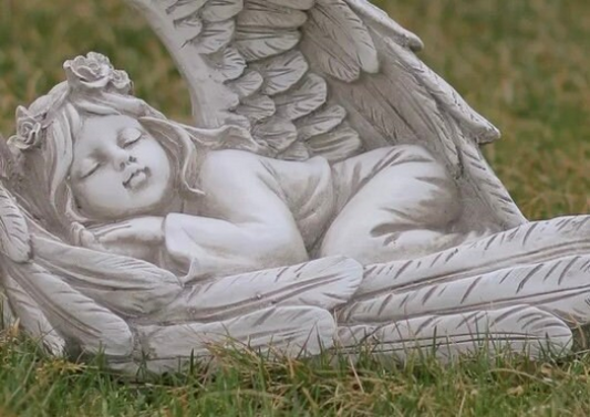 Sleeping angel figurine