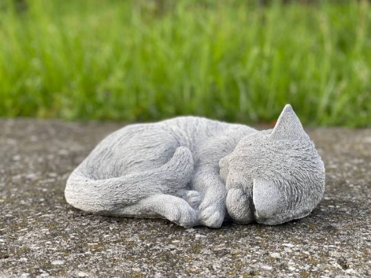 Concrete laying cat figurine