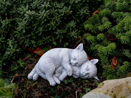 Two sleeping cats statue