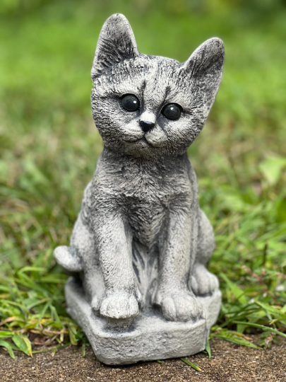 Concrete cat on basement statue