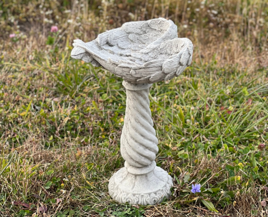 Bird bath wings of an angel statue