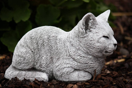 Sleeping curled up cat statue