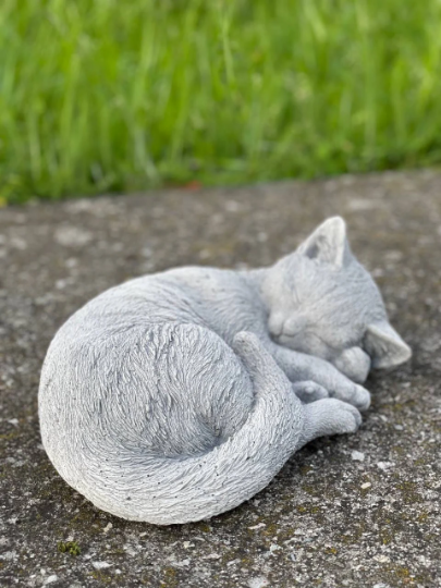 Concrete laying cat figurine