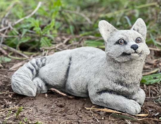 Lying concrete cat figurine