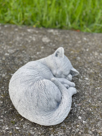 Concrete laying cat figurine