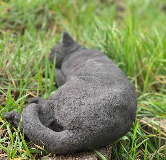 Sleeping cat concrete statue