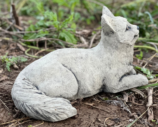 Lying concrete cat figurine